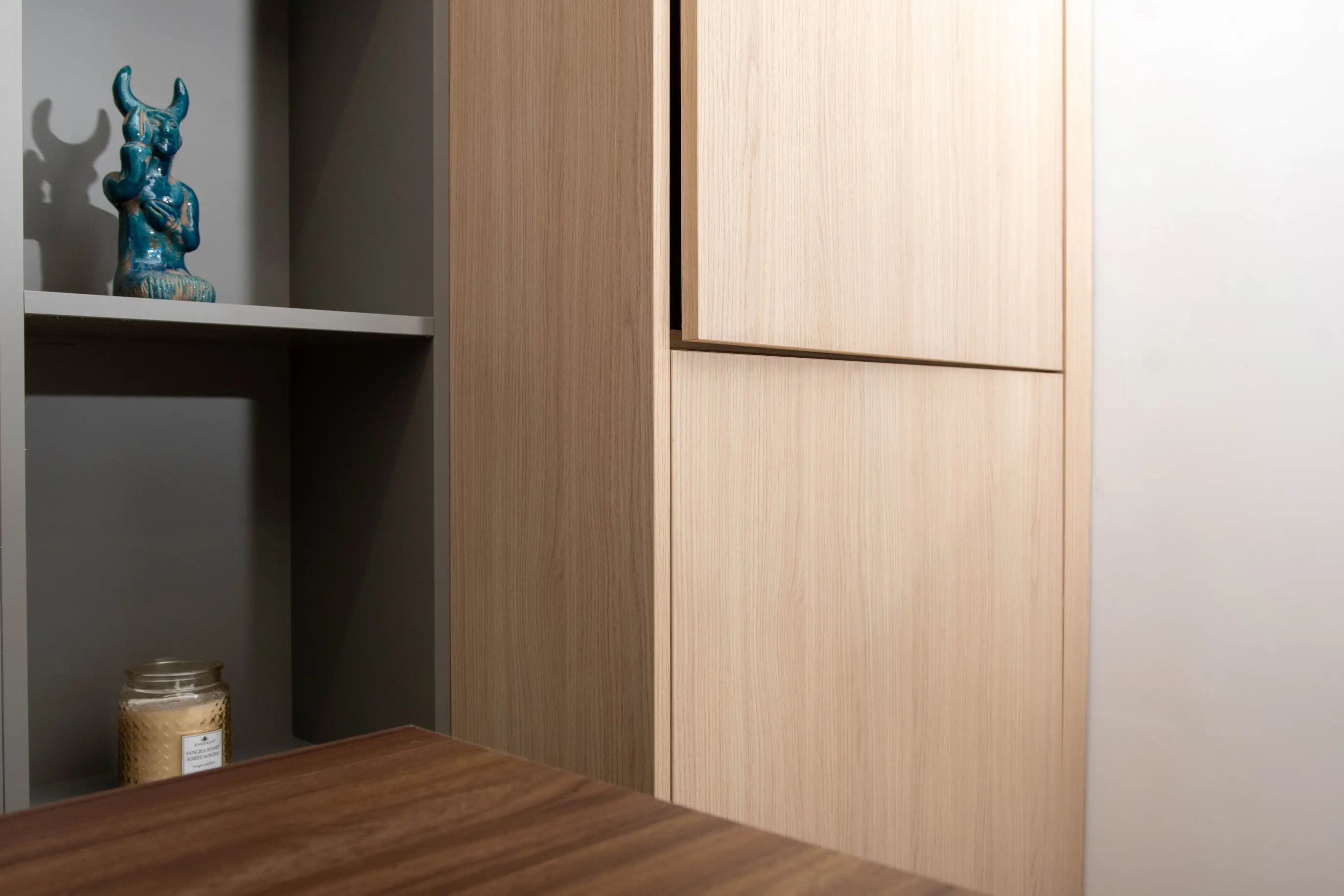 Cabinetmaker installing a drawer front